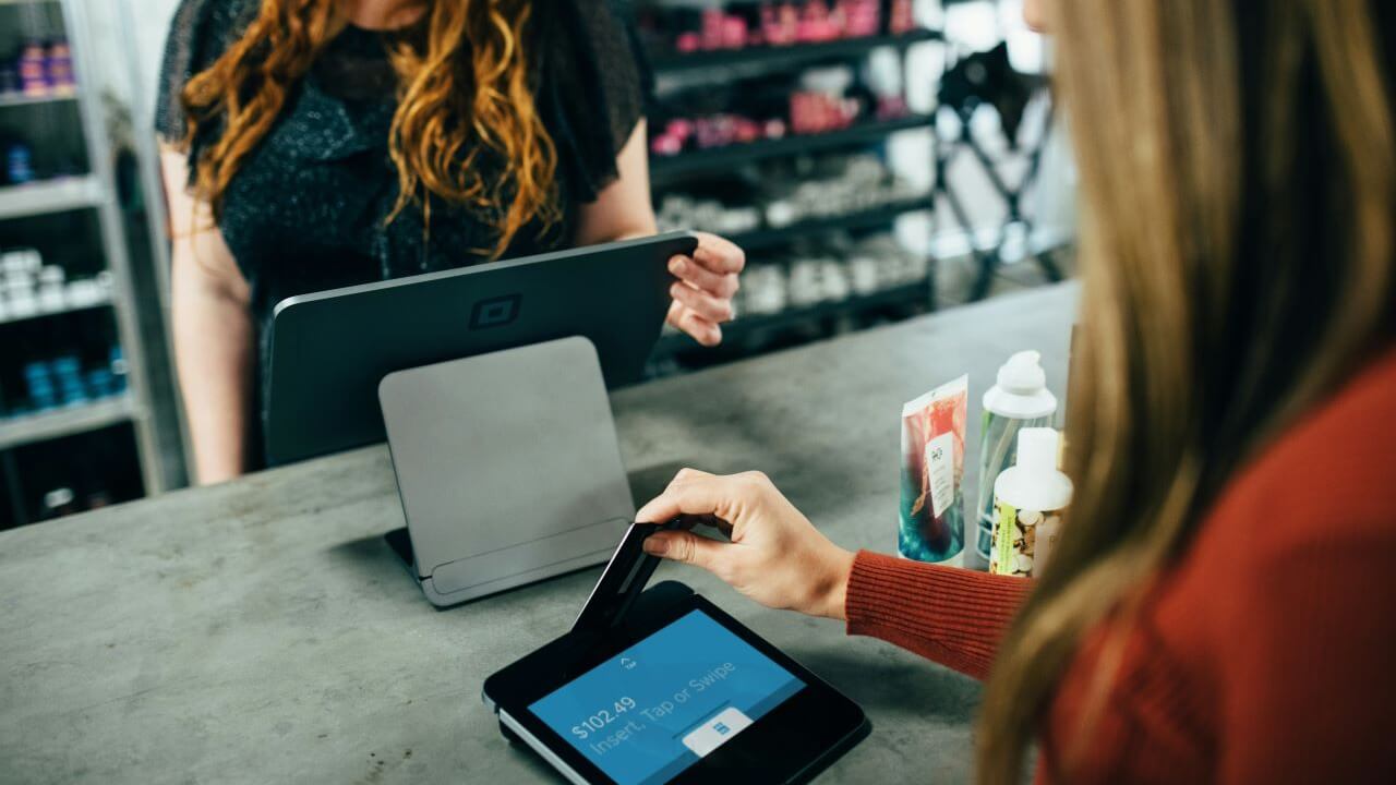Women Paying with Credit Card