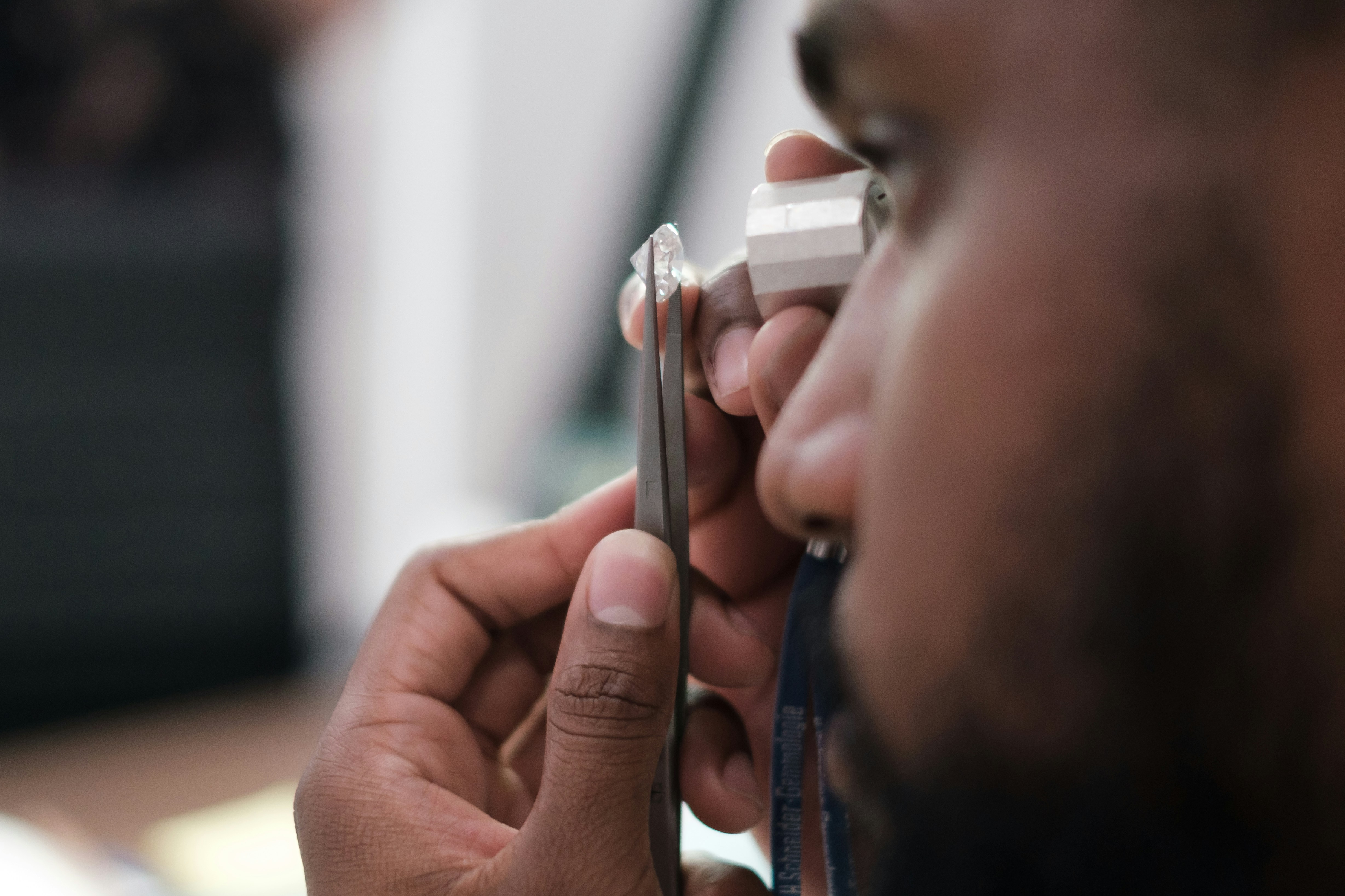 Man Examining Diamond Under Magnification