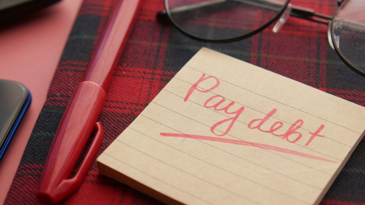 Note Saying Pay Debt